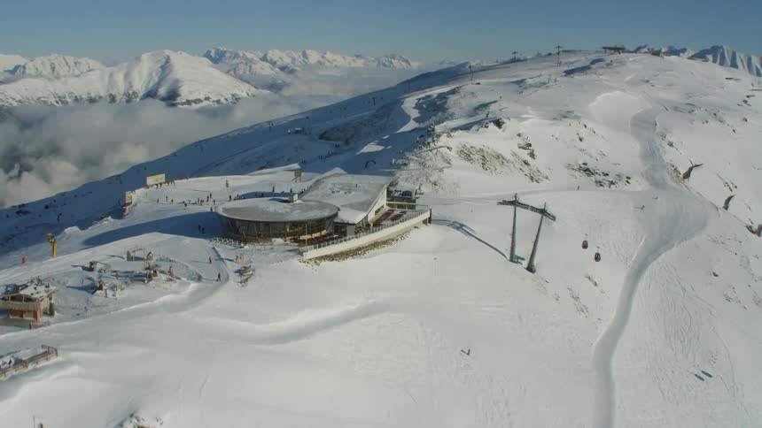 An aerial footage of a ski resort on top of the mountain
