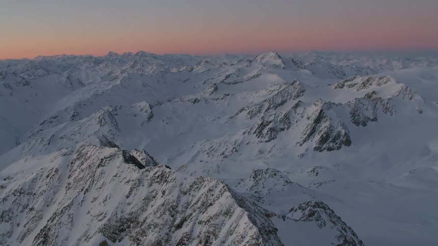 Snow covers a vast mountain range