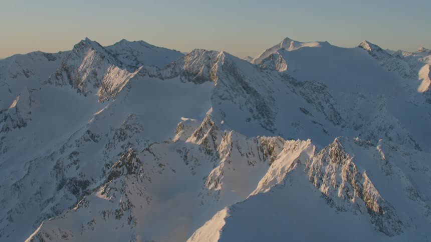 Mountain peaks peek out under heavy snow