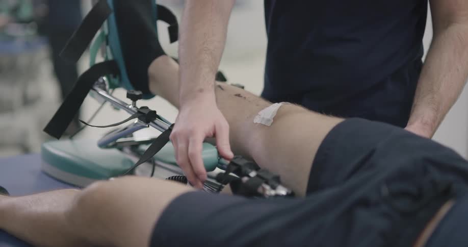 A man checking his patient leg condition