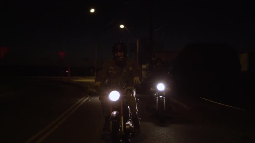Motorcycles drive at night