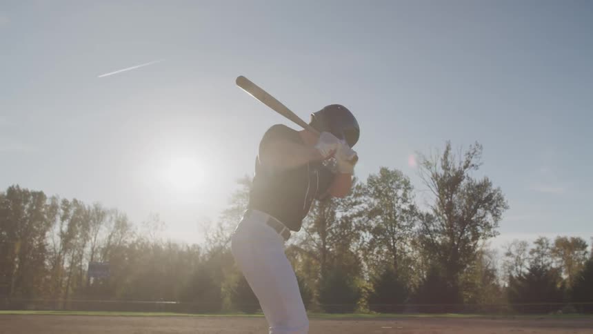 A man practices his batting swings