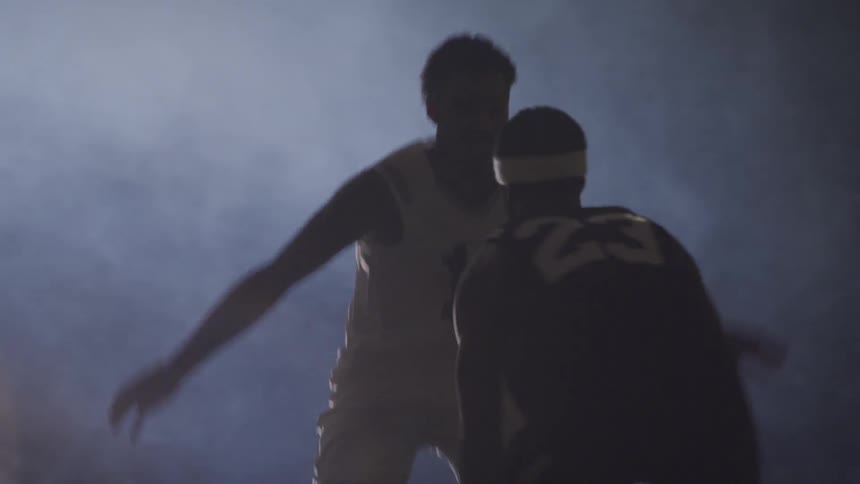 Young men playing basketball