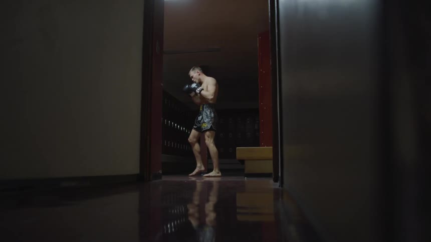 Man doing shadow boxing in the room