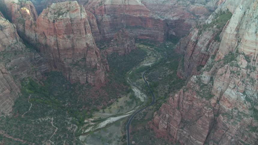 An aerial view of a river flowing through a rocky canyon in the wilderness