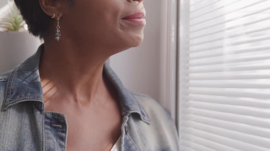 Woman looking out a window