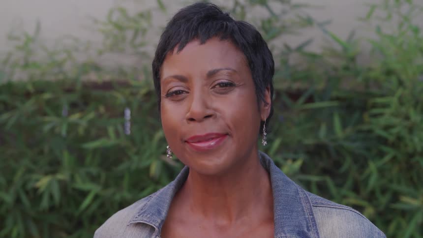 A portrait of a black woman in the garden