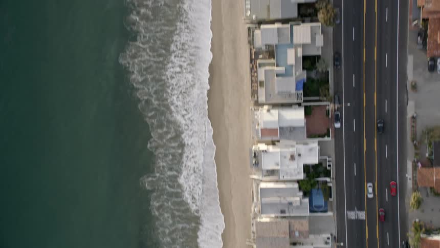 An aerial footage of a busy road near the beach, Pacific Coast Highway