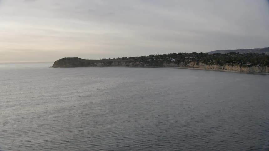 A rocky peninsula juts into the ocean