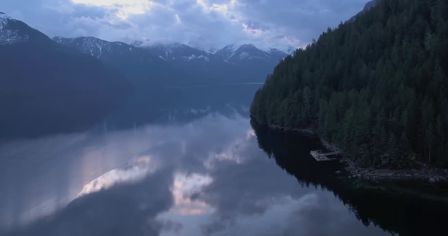 River between two forestcovered mountains