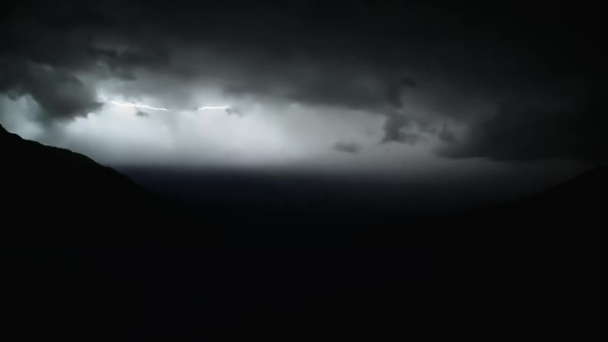 Several lightning bolts flashing across the dark sky