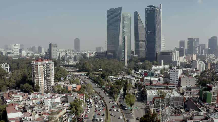 Vehicles travel a large city highway