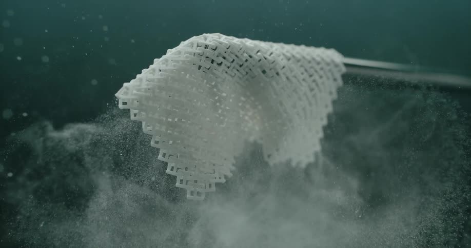 Close up of piece of cloth falling on metal rod