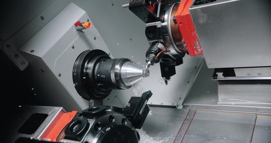 A machine is drilling into an object indoors