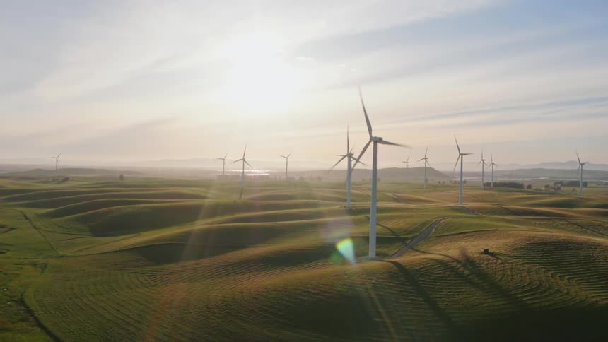 Windmills on a sunny field