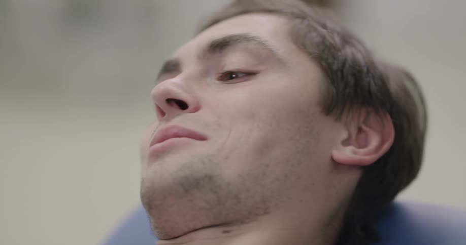 A man is laying down and talking