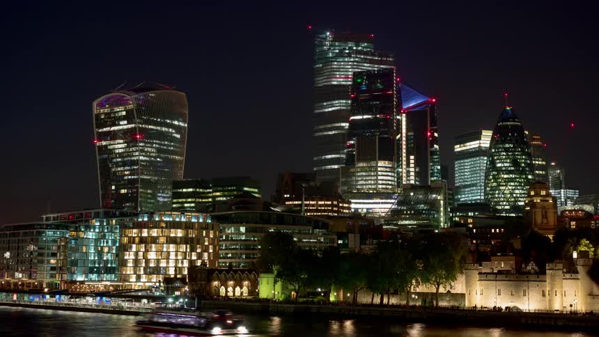 Skyline of the illuminated city with tall buildings and skyscrapers at night