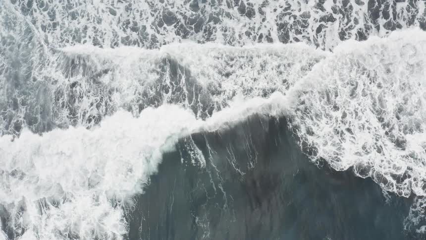 Waves crash against the shore