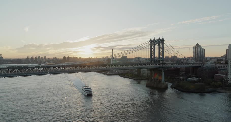 River ship sails under the bridge