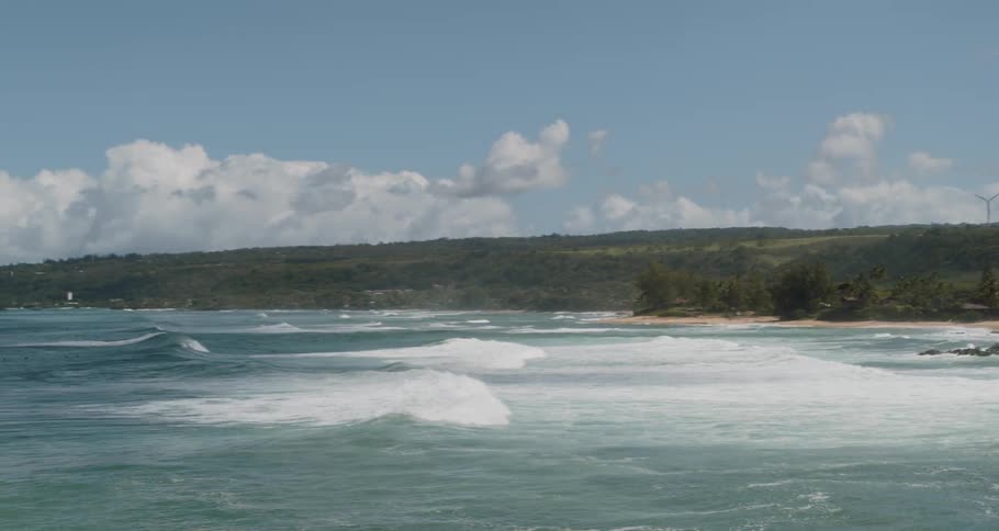 Waves crashing on a tropical white sand beach