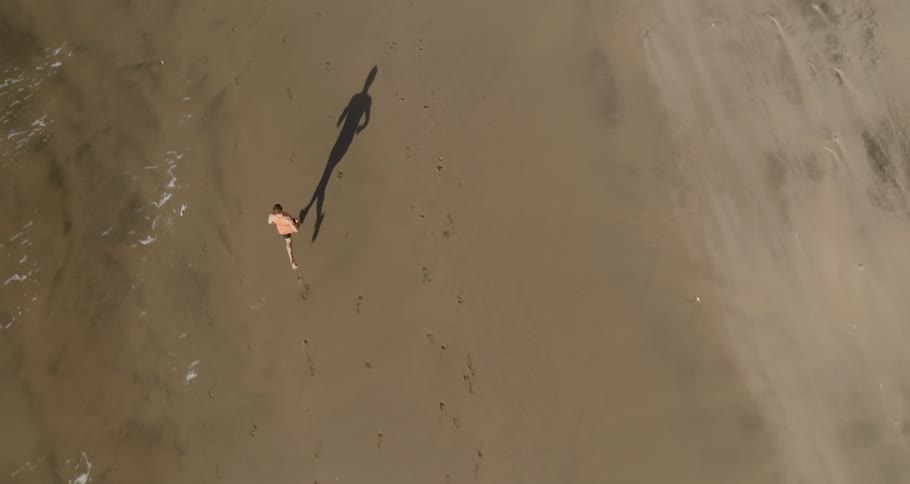 A person running on the beach