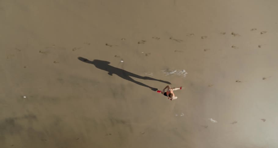 A man is running on the beach