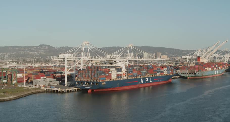 Cargo ships parked at loading dock at port in the harbor