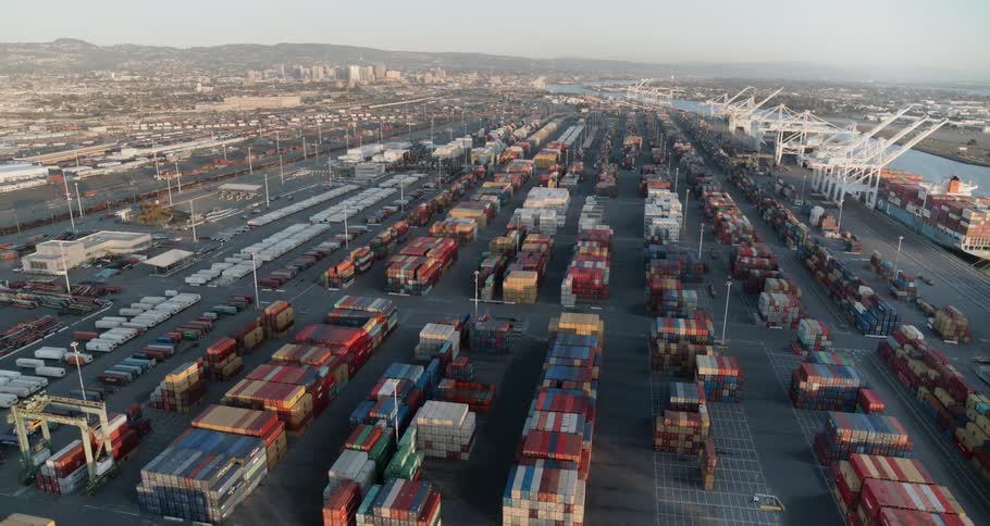 A shipping container port full of containers and cranes