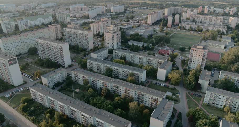 Large apartment buildings stretch across a flat area