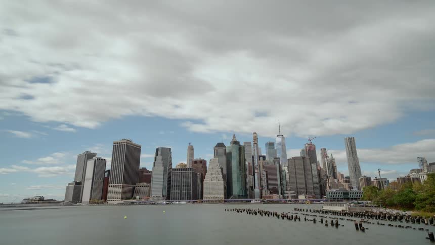 Clouds stream over a large city