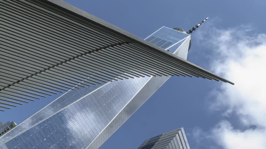 Clouds and sky reflect on the surface of a city skyscraper