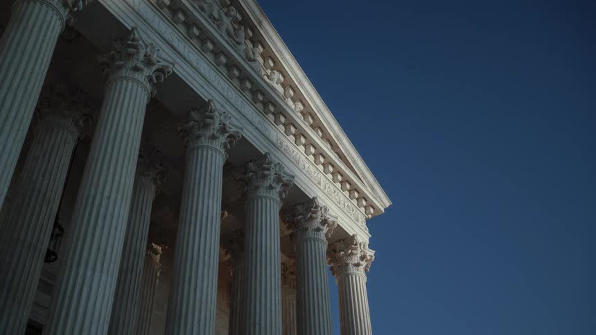 Sunlight and shadow travel across front of supreme court