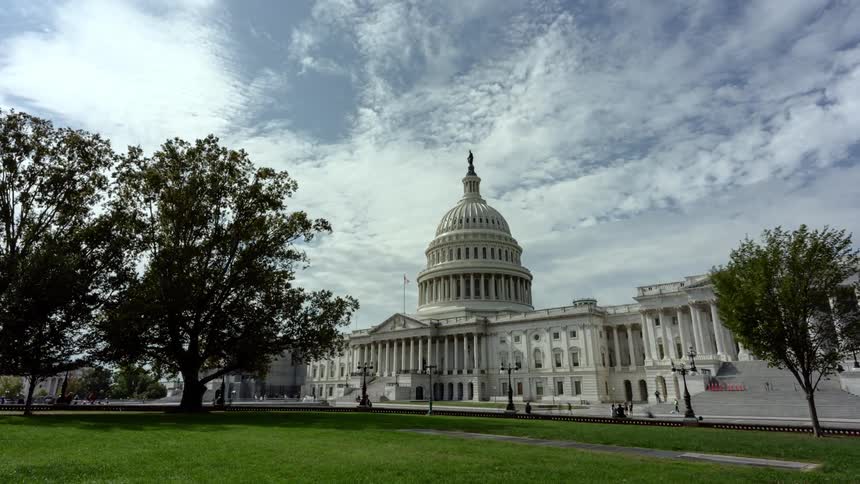 People walk around the grounds of the us capitol building
