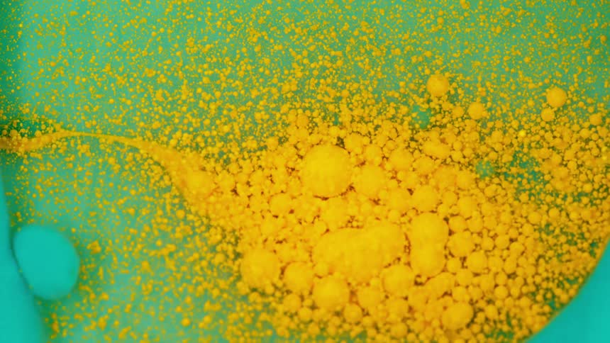 Paint is being mixed in a bowl