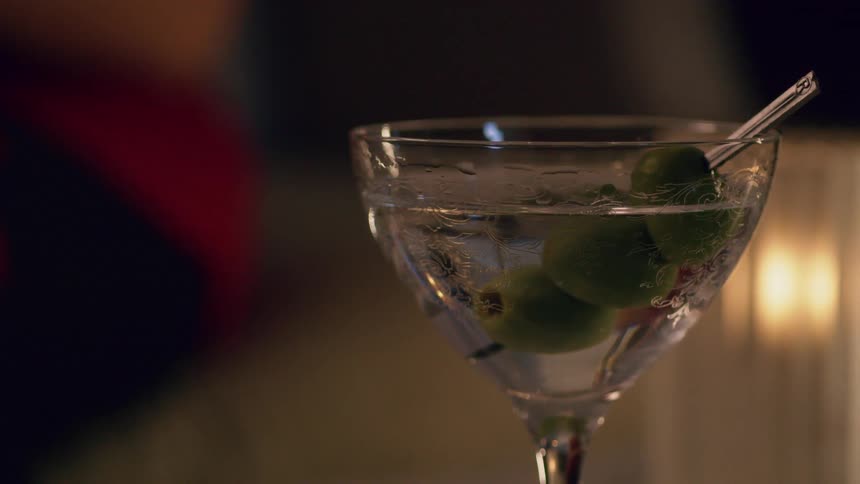 A mojito glass sits
