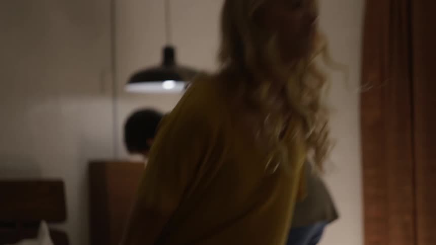 A man and woman in the bedroom