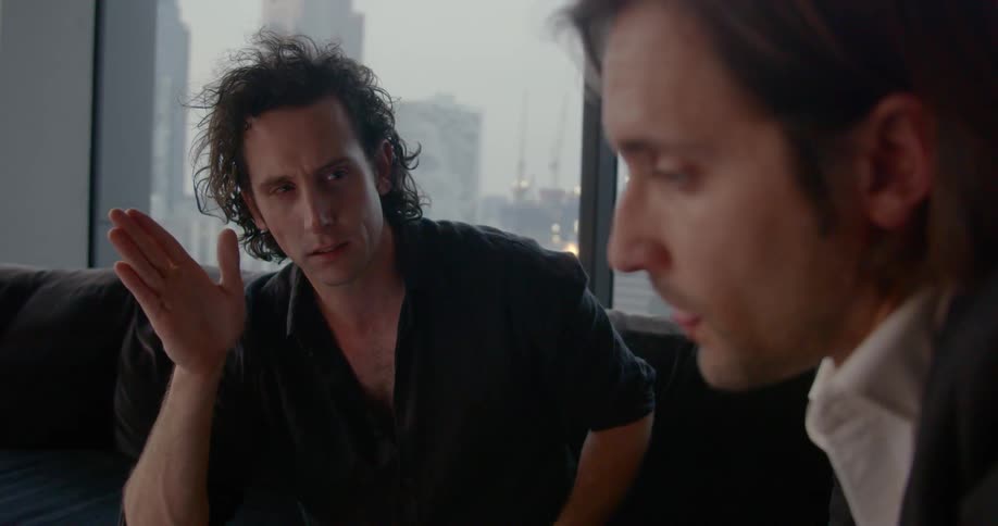 Two men discuss