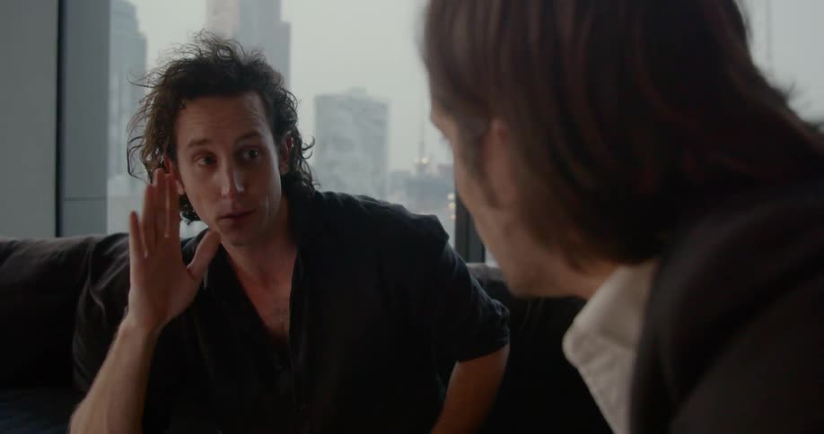 Two men brainstorm in an office