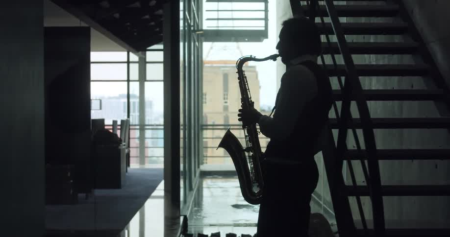 A man plays a saxophone