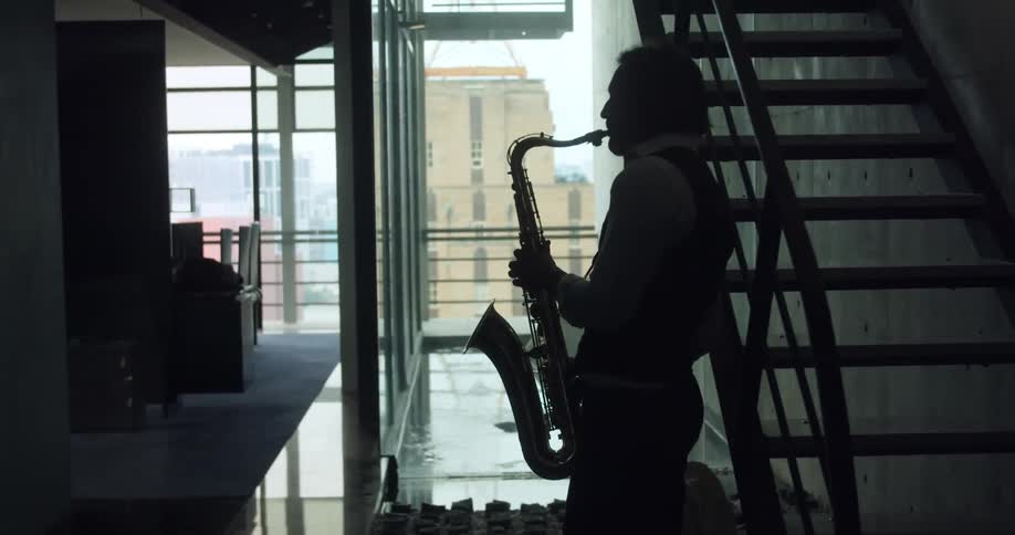 A man plays a saxophone