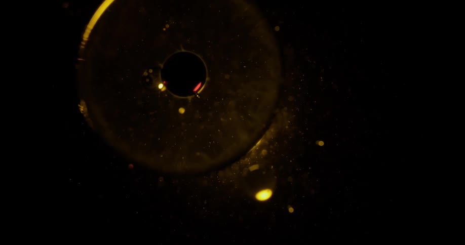 Close up view of a light coming out from under a disc