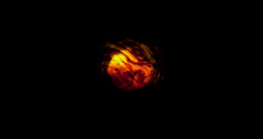 Black yellow and orange colors look like a glowing red sun