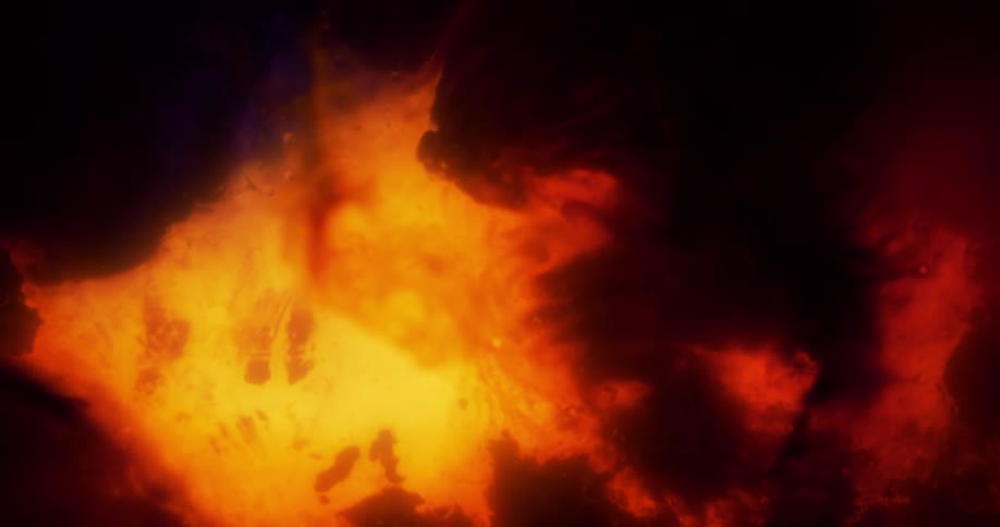 Smoke and liquids form a design that looks like fire