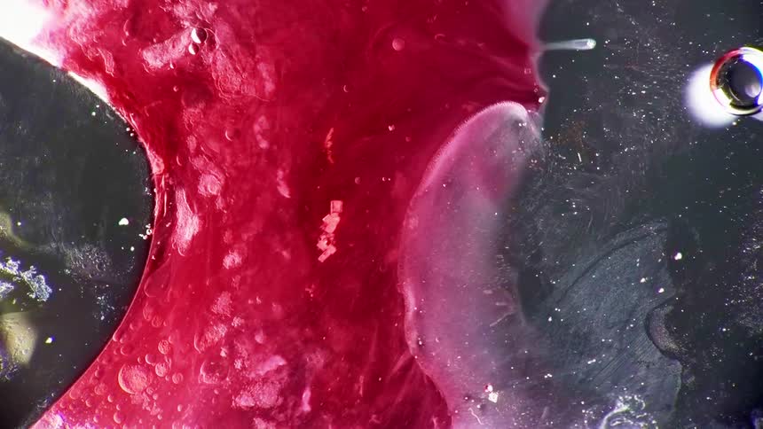 Colored fluid gives way to a clear gel like substance