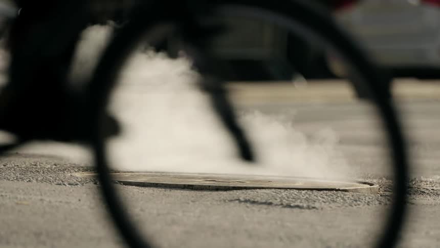 Smoke comes from the manhole