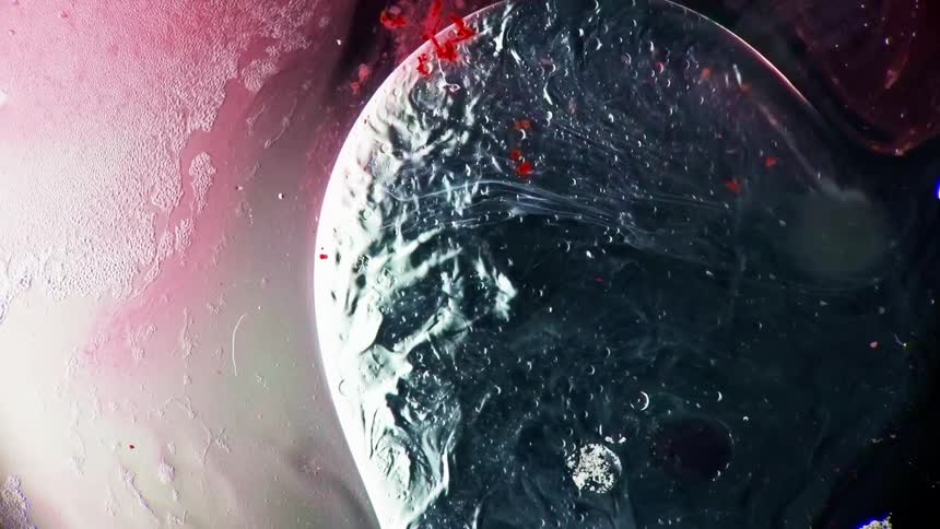 The liquid mixes around in the orb