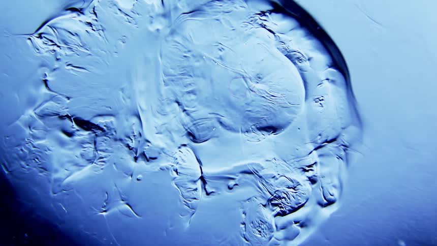 A blue liquid mixes and ripples in an almost alien manner