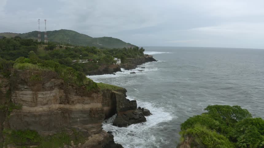 A sheer coastline on a cloudy day