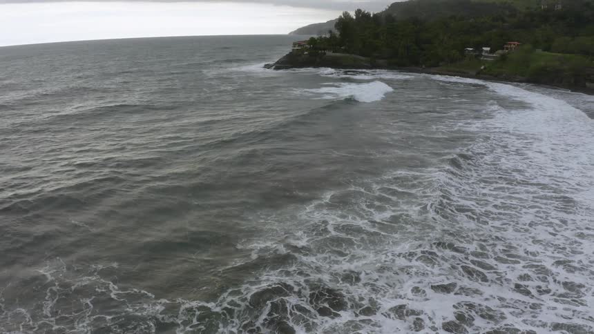 Waves crashing towards the shoreline