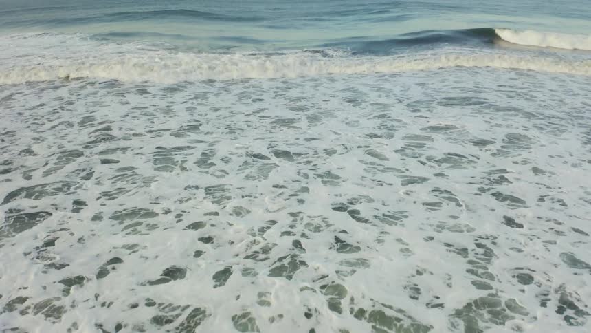 Waves crash on a shoreline